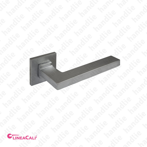 P.1300 - SINTESI - Lever handle pair for doors - Brass